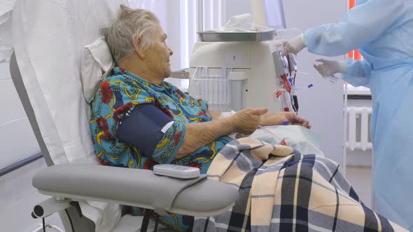 Old Woman in Hemodialysis Machine