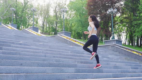 Slow Motion Female Jogger Running on Stairs