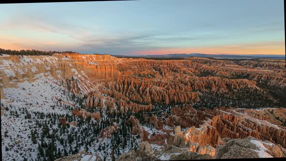 Aerial night to day time lapse movie of the sunrise over Bryce Canyon
