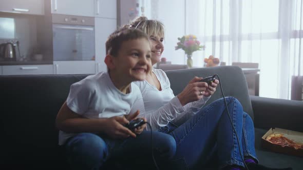 Joyful Family Spending Time Playing Video Game