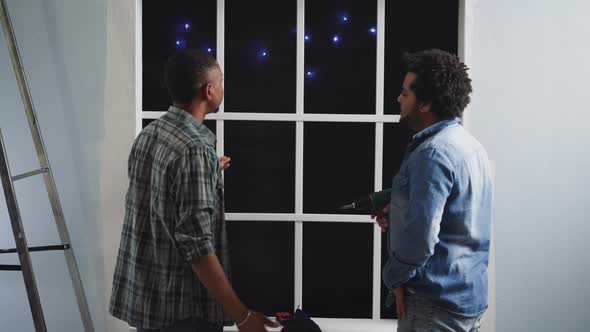 AfricanAmerican Builders Talk and Look at Constellations