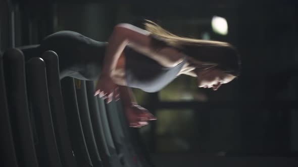 Wellness Young Female Athlete Run on a Treadmill Aerobic Exercise and Endurance Training in the Gym