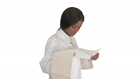 Smiling African American Female Doctor Reading Cardiogram on White Background