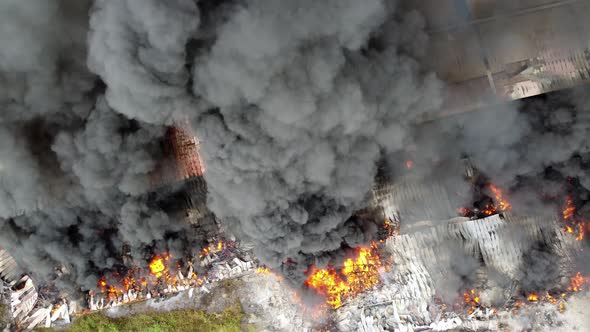 Aerial view fire burning industrial building
