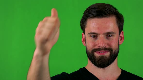 Young Handsome Bearded Man Shows Thumb Up on Agreement - Green Screen - Studio - Closeup