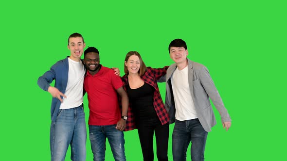 Group of Young People Smiling and Laughing in Front of Camera Thumbs Up on a Green Screen Chroma Key