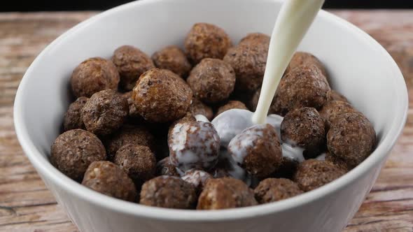 pouring milk in Chocolate cereal