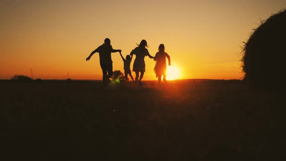 Family Silhouette with Sunset