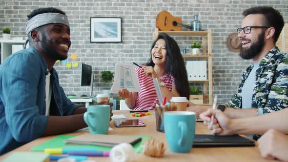 Girls and Guys Office Workers Discussing Smartphone App Design in Workplace