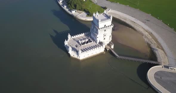 Aerial view of Torre de belem or Belem Tower in Lisbon, Portugal and the bridge Ponte 25 de Abril