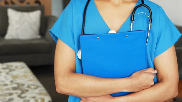 Portrait of female doctor holding a clipboard