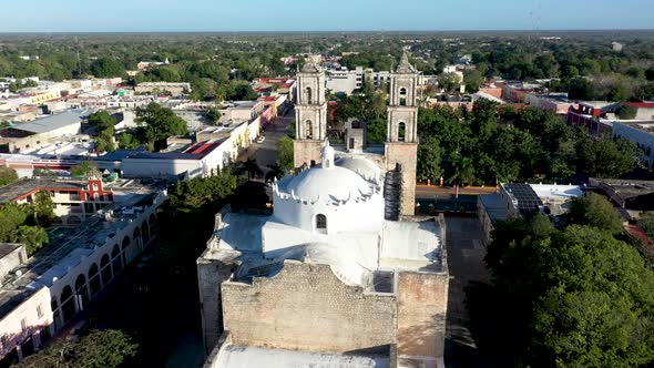 Aerial push in to the towers from back of the Catedral de San Gervasio showing full depth of the chu