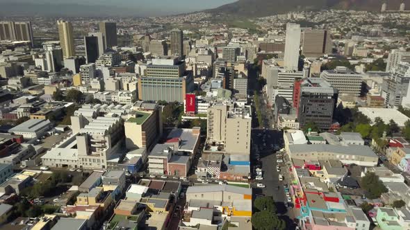 Scenic aerial wide drone shot above Bo-Kaap, Cape Town, South Africa. Tilt-down  with scenic view of