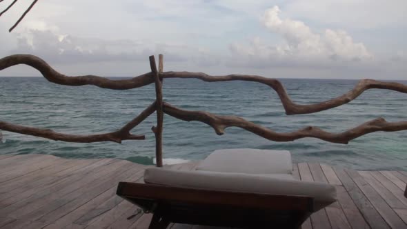 first person vision, long shot inside a balcony looking to the caribbean ocean during a cloudy day