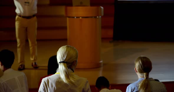 Mature African american businessman speaking in business seminar in auditorium 4k