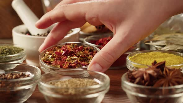 Colourful Spices in Glass Bowls Closeup