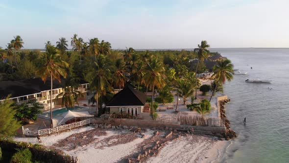 Paradise Beach Resort with Palm Trees and Hotels By Ocean Zanzibar Aerial View