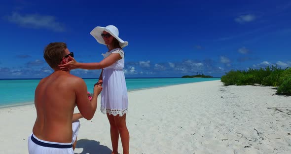 Happy people on romantic honeymoon have fun on beach on summer white sandy background 