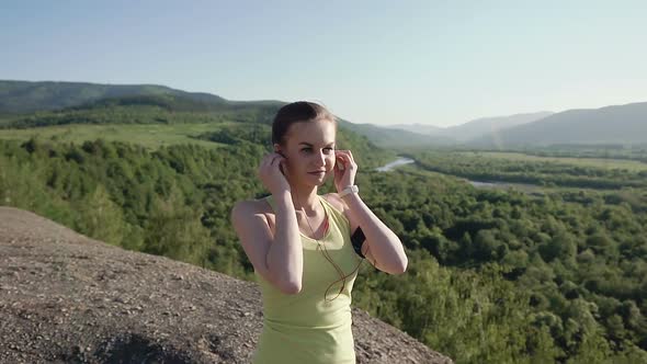 Runner Young Woman Running in Mountain Exercising Outdoors Fitness Tracker
