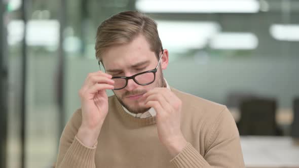 Young Creative Man Having Headache