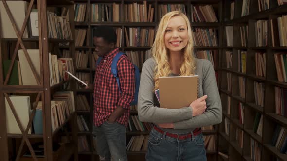 Young Female Student with Copybook