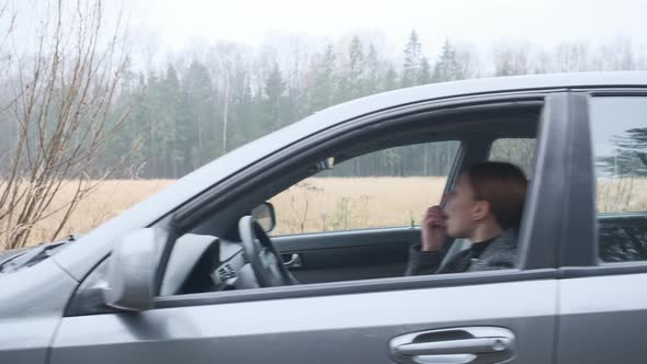 A Young Woman Crashes While Driving a Car 