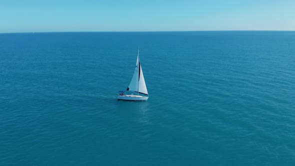 Aerial View. Big Sailing Yacht Boat Driving Thru the Ocean on a Sunny Day