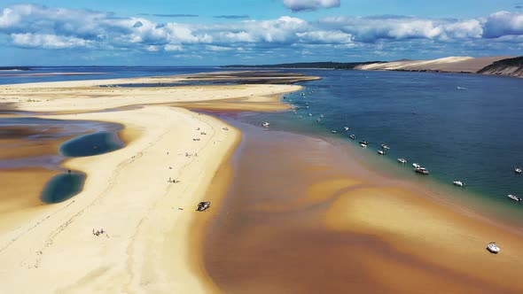 Banc d'Arguin in Arcachon Bay France with boats stationed in a row along the sandbank, Aerial flyove