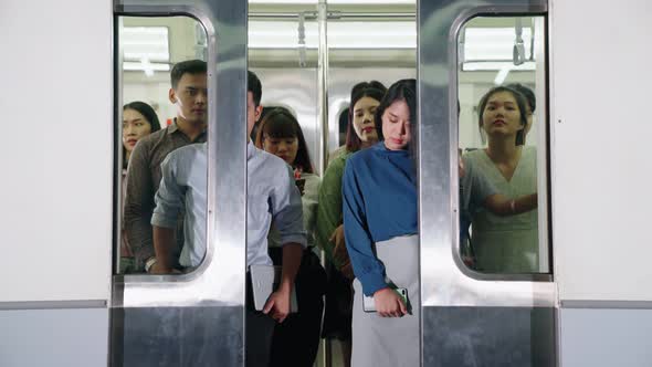 Crowd of People on a Busy Crowded Public Subway Train Travel