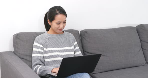 Woman Use of Laptop Computer at Home