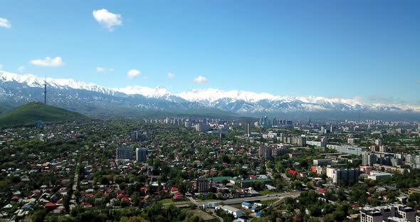 Green City with Snowy Mountains of Almaty