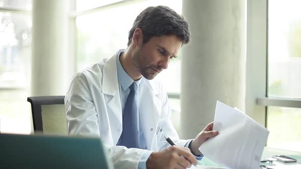 Doctor doing a consult, viewed from patients perspective