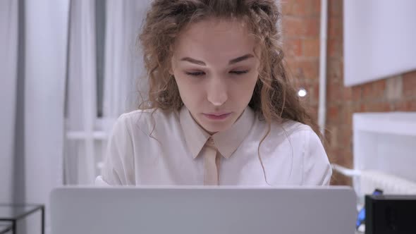 Tired Female Girl Relaxing Muscles While Working on Laptop