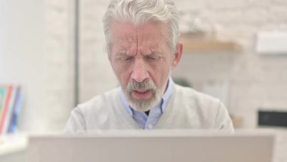 Close Up of Sick Old Man Coughing at Work
