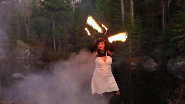 Beautiful Woman Performing Fire Spinning