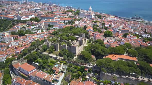 sunny day Lisbon famous saint george (sao jorge) castle aerial panorama 4k Portugal with alfama in b