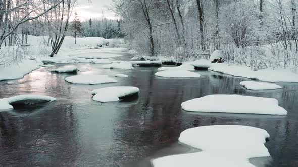 Rocks Filled White Snow in the River in Estonia