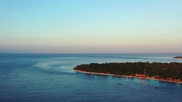 Aerial drone shot seascape of luxury coastline beach journey by blue sea and white sand background o