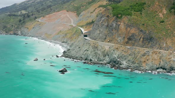 Rocky Cliffs Aerials Coastal Transportation  Aerial of Curving Coastal Road