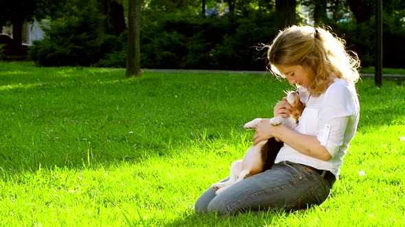Portrait of a Woman with Her Beautiful Beagle Dog Outdoors