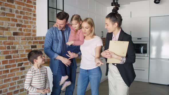 Video of happy family during buying a new apartment. Shot with RED helium camera in 8K.