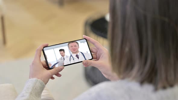 Doctor Talking During Video Chat in Smartphone Screen