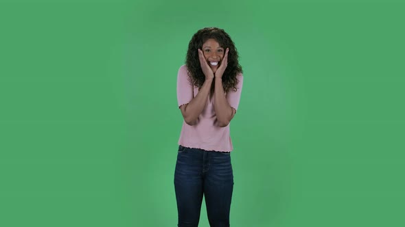 Portrait of Beautiful African American Young Woman Is Looking at Camera with Shocked and Surprised