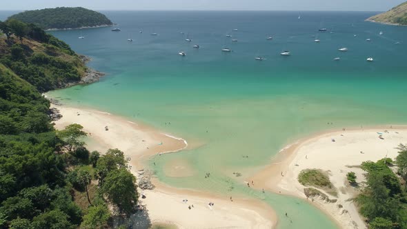 Aerial view drone camera of Beautiful tropical sea sandy beach and waves crashing against sand beach