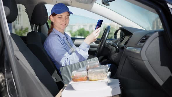 Grocery Delivery, Female Courier Works in Supply Service in Cafe or Restaurant and Checks Order of