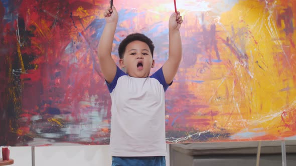 Little Boy Happy With Abstract Painting