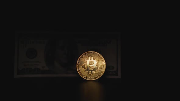 Bitcoin Coin and 100 Dollar Bill