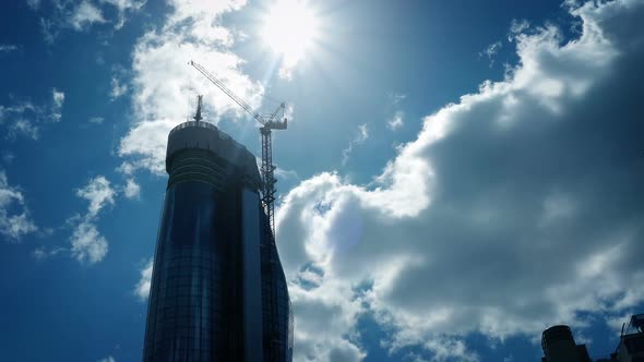 Passing A Huge Modern Building With Sun Above