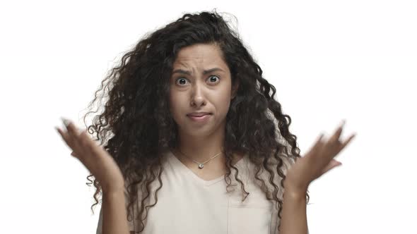 Closeup of Shocked and Confused Latino Girl Cant Understand Something Strange Shaking Head and