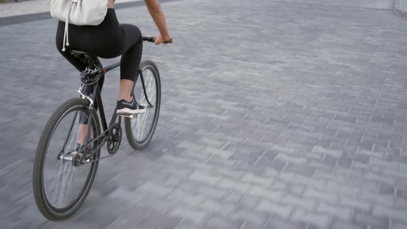 Young Woman Riding a Bicycle Outdoor